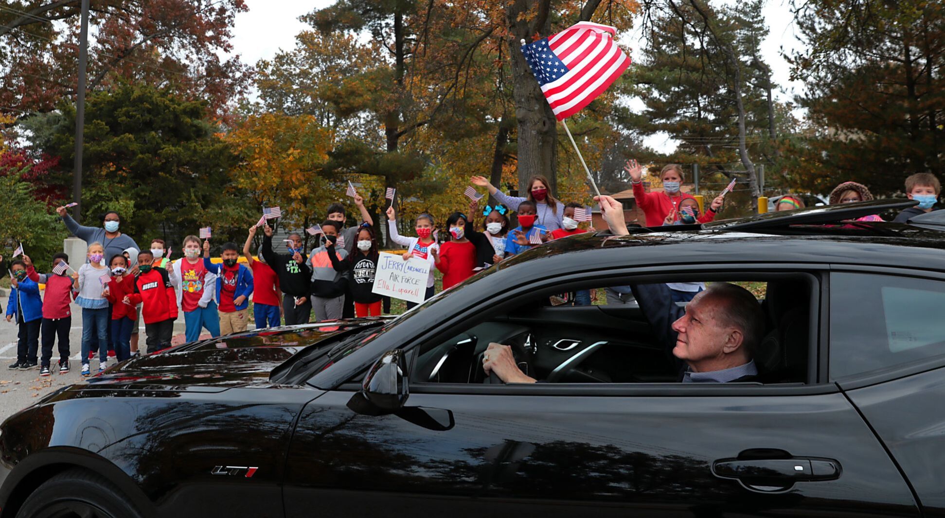 Students honor veterans with drive-by parade